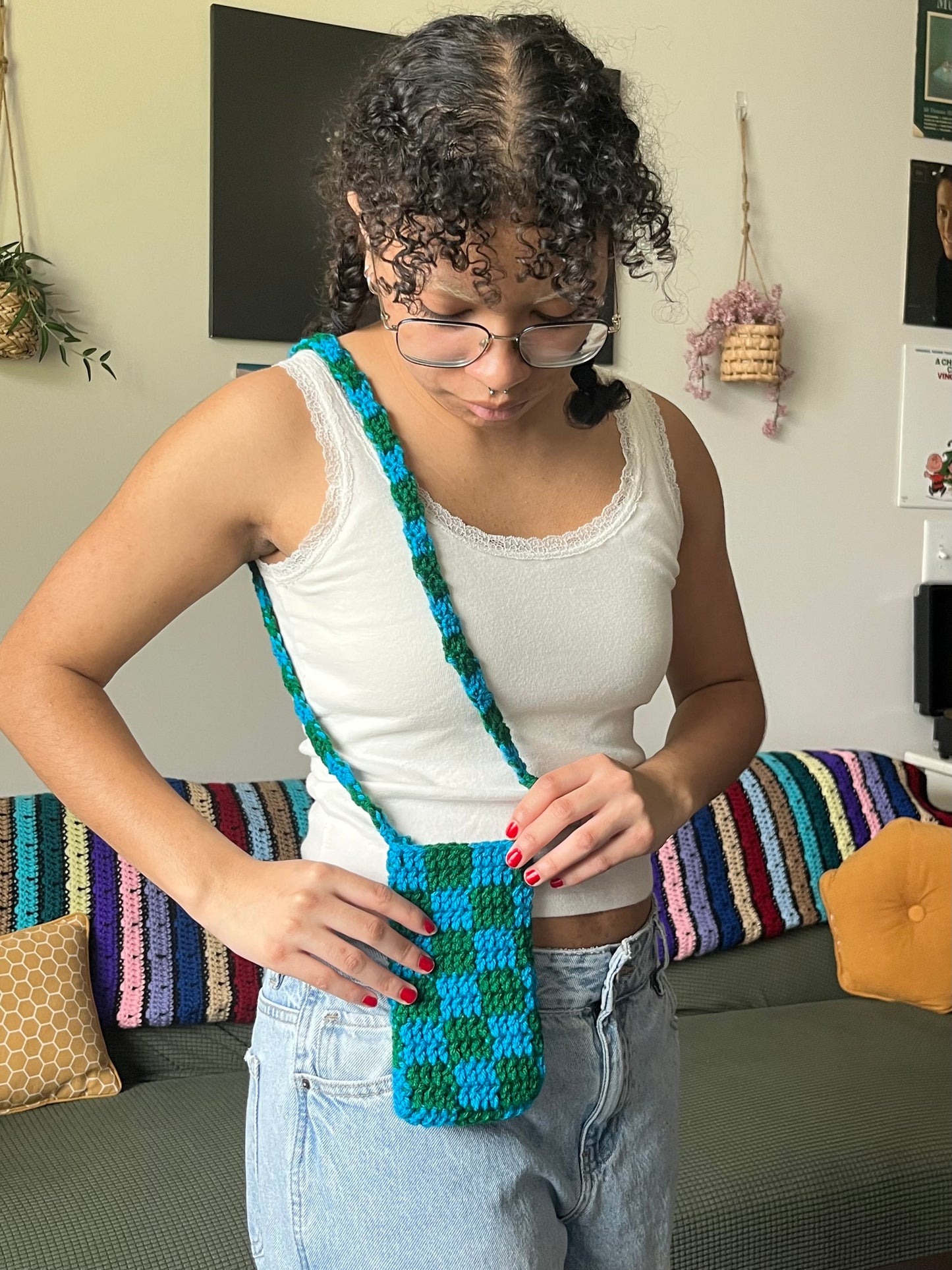 blue and green checkered phone bag